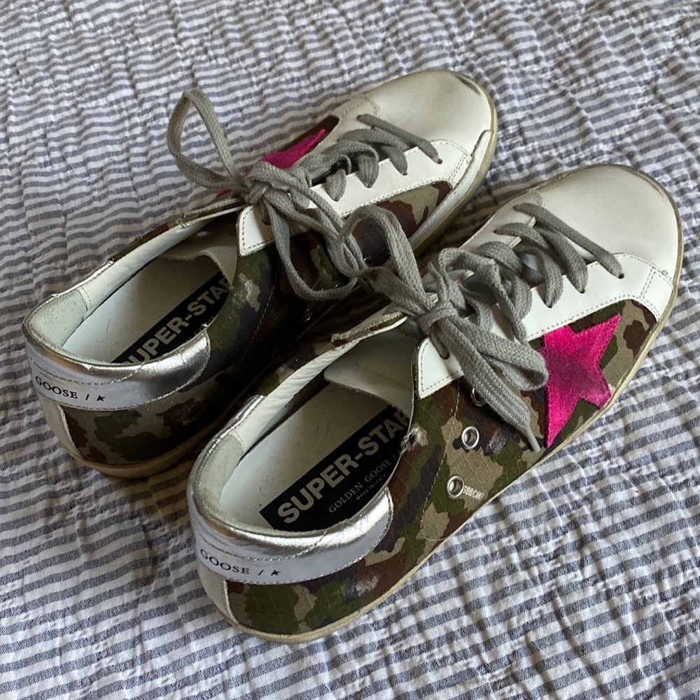 Golden Goose Super-Star Sneakers with camouflage pattern and fuchsia star.